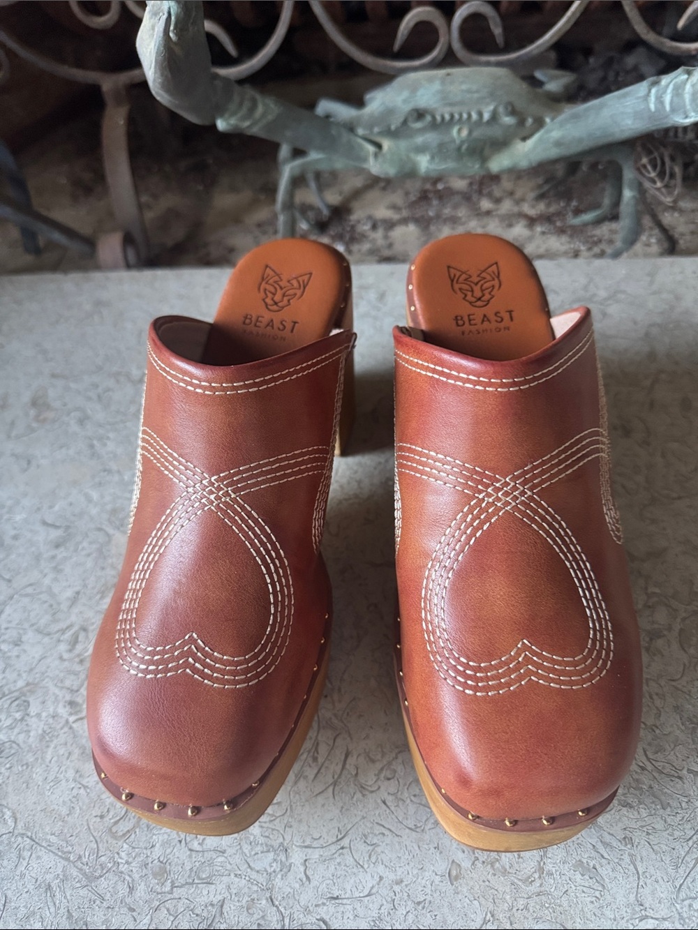 Beast Fashion brown platform clogs with white embroidery
